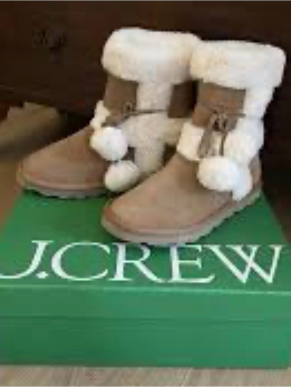Faux-fur booties in suede with pom-poms